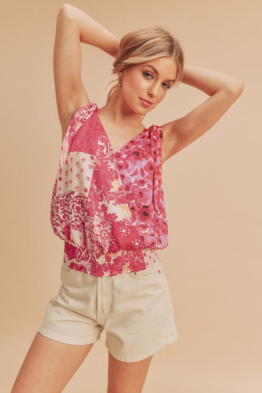 Chic printed surplice tank with a smocked hem, perfect for stylish and flattering summer outfits.