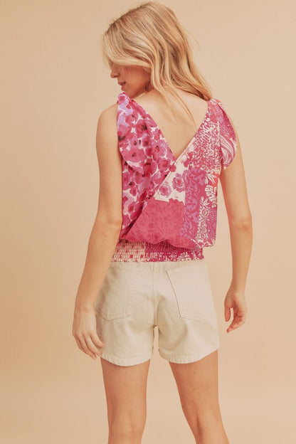 Chic printed surplice tank with a smocked hem, perfect for stylish and flattering summer outfits.