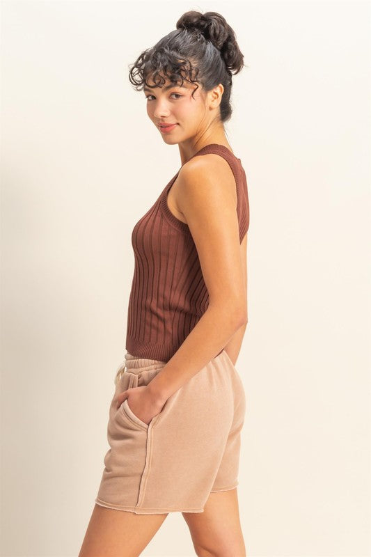 Stretchy ribbed round neck sweater tank in a sleek, versatile design for effortless styling.