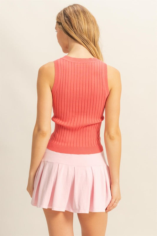 Stretchy ribbed round neck sweater tank in a classic sleeveless design, perfect for layering or everyday wear.