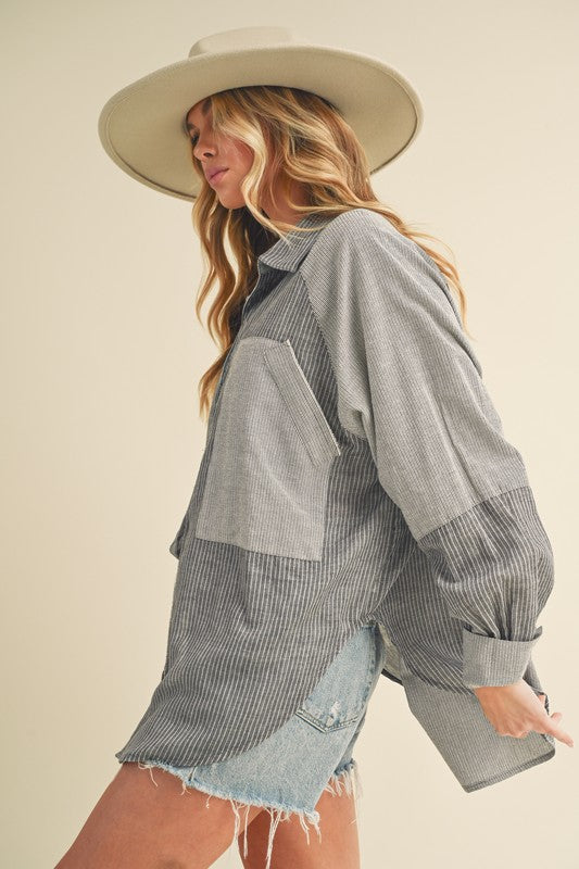 Stylish striped shirt with a collared neckline and trendy lantern sleeves, perfect for an elegant and versatile look.