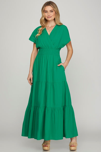 Elegant surplice short sleeve tiered maxi dress with pockets, perfect for casual and formal occasions.