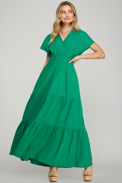 Elegant surplice short sleeve tiered maxi dress with pockets, perfect for casual and formal occasions.