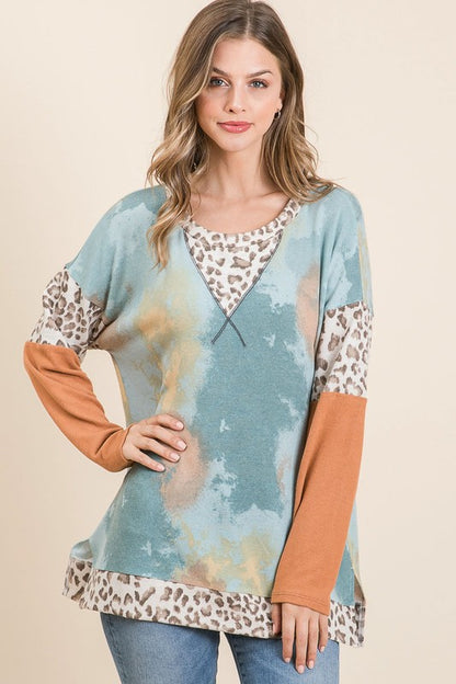 Trendy tie-dye leopard print long sleeve T-shirt with a classic round neckline, perfect for a bold and stylish look.