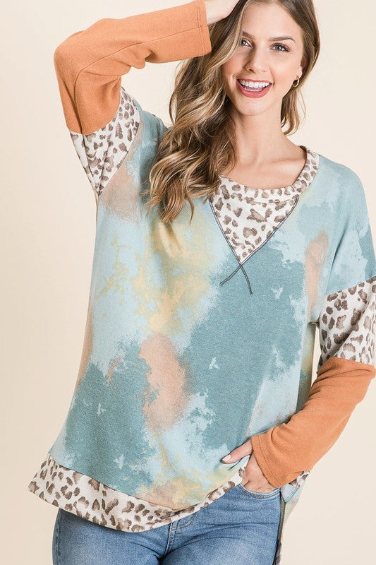 Trendy tie-dye leopard print long sleeve T-shirt with a classic round neckline, perfect for a bold and stylish look.