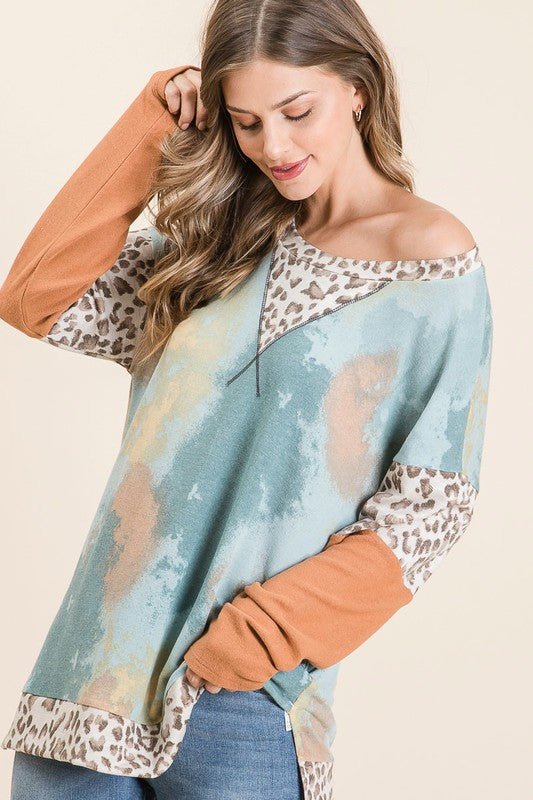 Trendy tie-dye leopard print long sleeve T-shirt with a classic round neckline, perfect for a bold and stylish look.