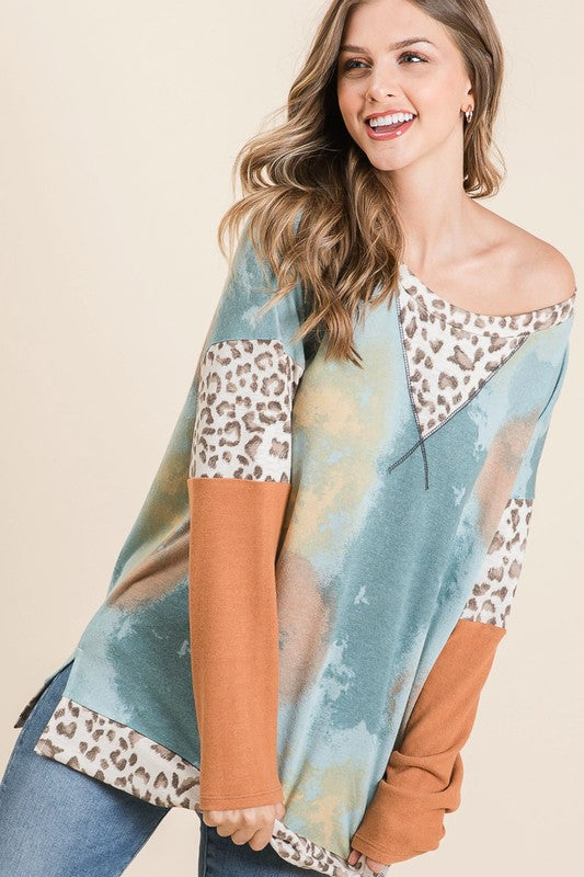 Trendy tie-dye leopard print long sleeve T-shirt with a classic round neckline, perfect for a bold and stylish look.