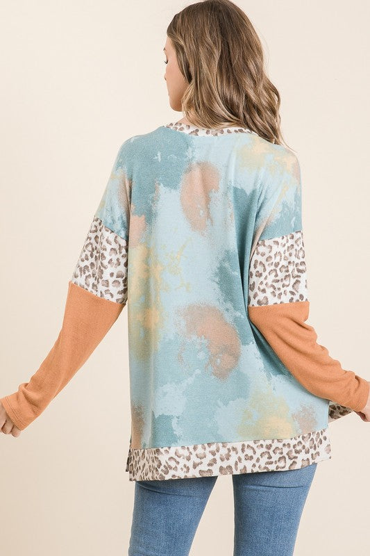 Trendy tie-dye leopard print long sleeve T-shirt with a classic round neckline, perfect for a bold and stylish look.