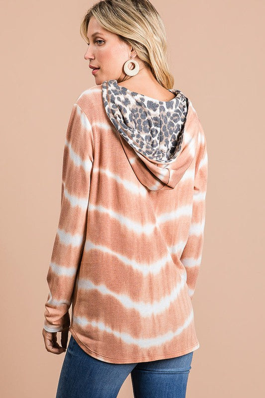 Trendy tie-dye stripe terry hoodie with leopard print details, a drawstring hood, and a cozy fit for a stylish casual look.