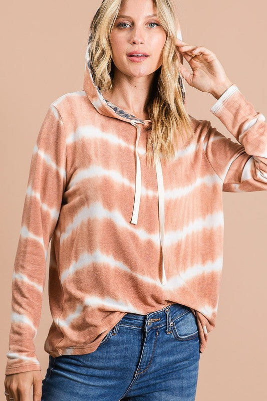 Trendy tie-dye stripe terry hoodie with leopard print details, a drawstring hood, and a cozy fit for a stylish casual look.