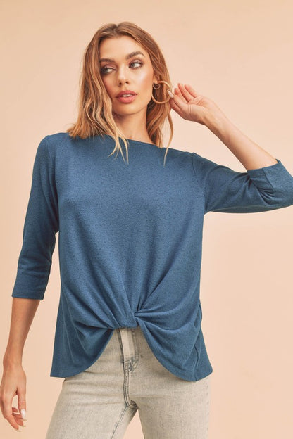 Stylish twist front round neck 3/4 sleeve t-shirt in a flattering design, perfect for casual and chic outfits.