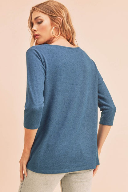 Stylish twist front round neck 3/4 sleeve t-shirt in a flattering design, perfect for casual and chic outfits.