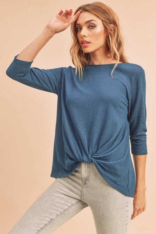 Stylish twist front round neck 3/4 sleeve t-shirt in a flattering design, perfect for casual and chic outfits.