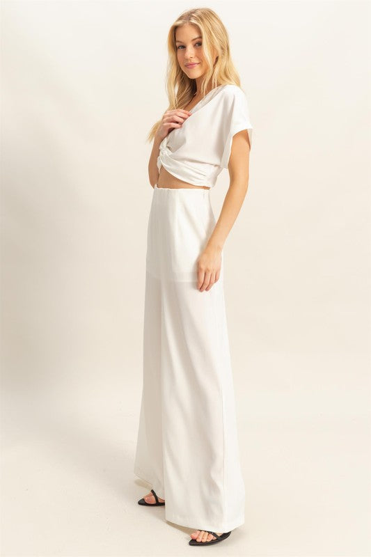 Stylish twisted front short sleeve top & high-waisted wide leg pants set, designed for a modern & effortlessly chic look.