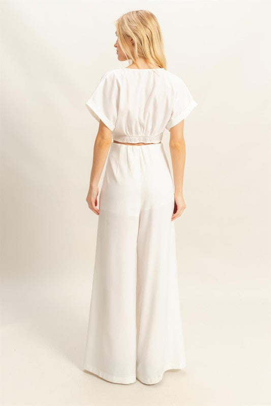 Stylish twisted front short sleeve top & high-waisted wide leg pants set, designed for a modern & effortlessly chic look.