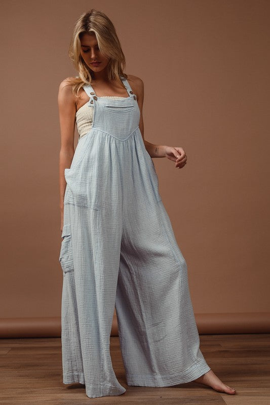 Vintage washed crinkle gauze wide-leg overalls with adjustable straps and side pockets for a relaxed, trendy look.